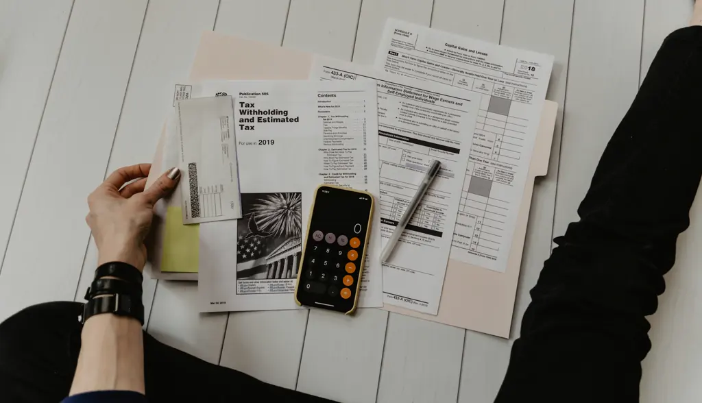 Financial statements and a calculator on a desk